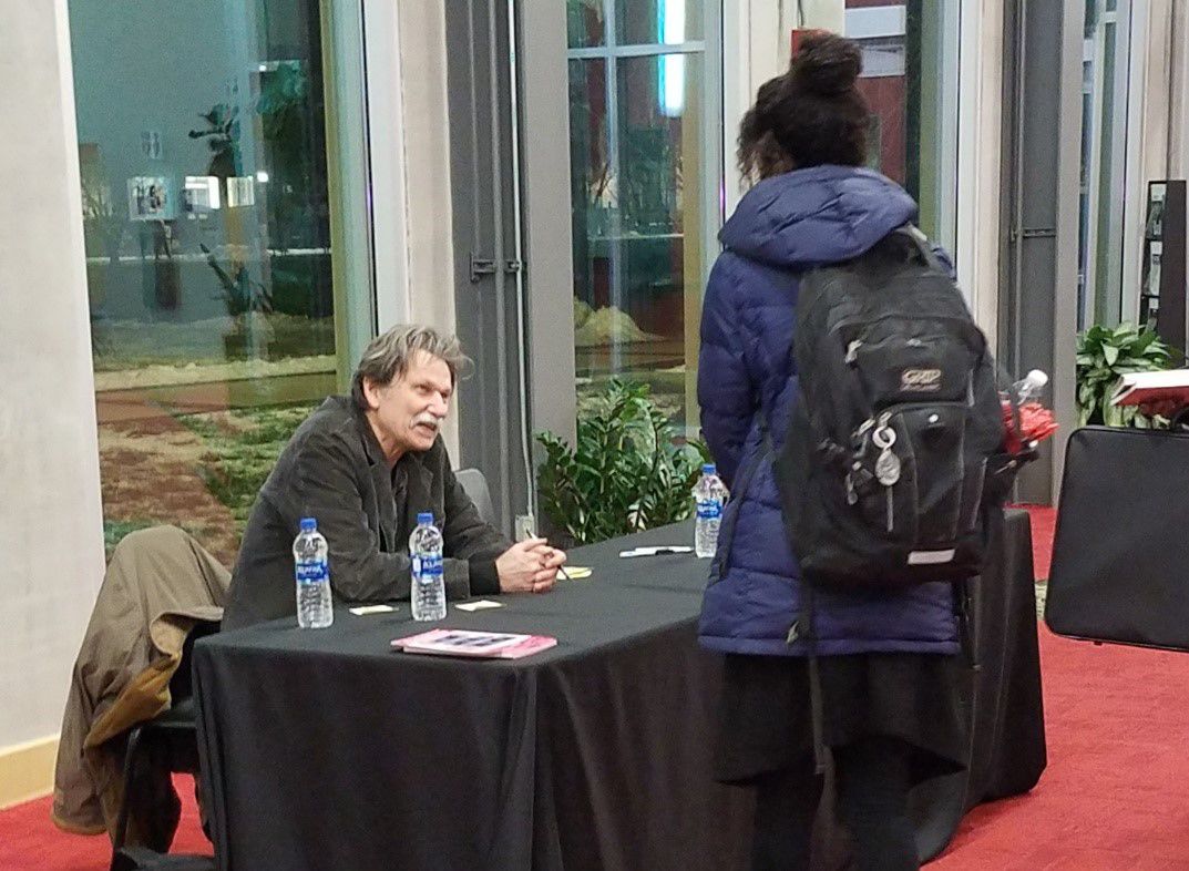 Gregory Orr signing books at the Schrott Center for the Arts